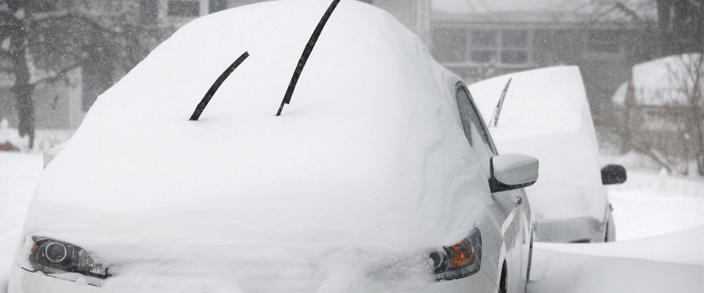 Cars buried under snow